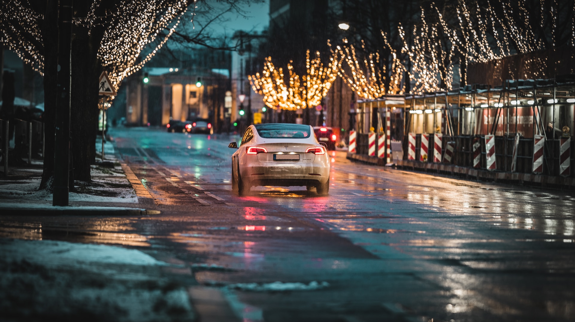 white car on road during night time